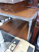 A CHROME FRAMED TWO TIER TABLE.