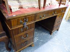 A GOOD QUALITY MAHOGANY PEDESTAL DESK AND TWO ARMCHAIRS.