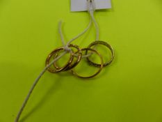 TWO GOLD RINGS AND A PAIR OF GOLD EARRINGS.