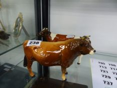 TWO BESWICK COWS.