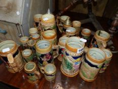 A QTY OF ORNAMENTAL BEER STEINS.