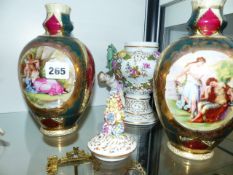 A PORCELAIN CHERUBIC VASE AND COVER AND A FURTHER PAIR OF VASES.