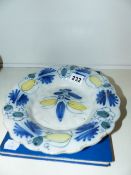 AN ANTIQUE DELFT BOWL AND A STAMP ALBUM.