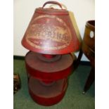 A RED PAINTED ADVERTISING DISPLAY STAND FOR MOTORINE OIL.
