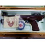A BOXED GERMAN ORIGINAL AIR PISTOL CAL 5.5/.22 WITH ADJUSTABLE SIGHTS AND BROWN PLASTIC GRIP.