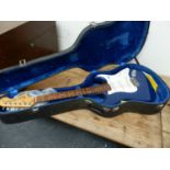 A COPY OF A FENDER STRATOCASTER BLUE BODY GUITAR.