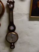 A MAHOGANY WHEEL BAROMETER, THE BROKEN PEDIMENT ABOVE DRY/DAMP DIAL, MERCURY THERMOMETER, CONVEX
