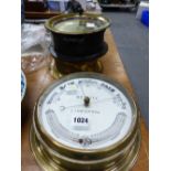 AN ELLIOTT BRASS CASED SHIPS TIMEPIECE ANOTHER BY GENERAL ELECTRIC TOGETHER WITH A SEWILL BRASS