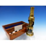 A MAHOGANY CASED STUDENTS BRASS MONOCULAR MICROSCOPE WITH THREE OBJECTIVES, THE CASE. W 20.5cms.