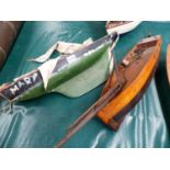 AN ANTIQUE SMALL POND YACHT WITH BLACK AND GREEN HULL, TOGETHER WITH THREE FURTHER SMALL MOTOR