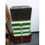 A SMALL CAST IRON SAFE AND TWO NESTS OF COLLECTORS DRAWERS.