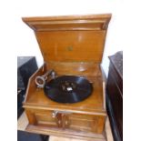 AN OAK CASED PATHEPHONE WIND UP GRAMOPHONE WITH START/STOP LEAVER ABOVE DOORS OPENING TO RELEASE