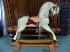 A GOOD QUALITY HAND MADE ROCKING HORSE RESTORED BY ROBERT MULLIS. H.HOOF TO EAR 90cms, OVERALL FLOOR