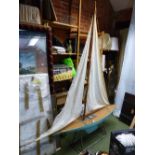 A LARGE EARLY 20th.C. RIGGED POND YACHT "WHO CARES", WITH BRASS FITTINGS, BLUE PAINTED HULL AND