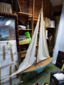 A LARGE EARLY 20th.C. RIGGED POND YACHT "WHO CARES", WITH BRASS FITTINGS, BLUE PAINTED HULL AND