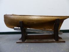 A 19th.C. POND YACHT WITH FAUX PLANK DECK AND CARVED SINGLE PIECE BELLIED HULL AND LEAD WEIGHTED