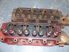 TWO BRITISH FOUR CYLINDER ENGINE HEADS, PROBABLY AUSTIN.