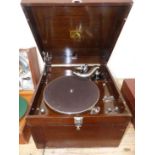 AN HMV MODEL 113A WOOD CASED WIND UP TABLE TOP GRAMOPHONE WITH SIDE CARRYING HANDLE AND CHROME CORNE