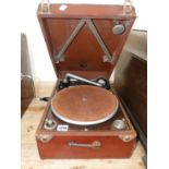A LEATHER CASED COLUMBIA WIND UP GRAMOPHONE WITH RECORD HOLDER WITHIN THE LID, THE BROWN BAIZE