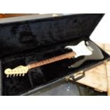 A SQUIRE STRAT BLACK BODY ELECTRIC GUITAR IN CARRYING CASE.