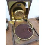 A CROCODILE LEATHER CASED DECCA WIND UP GRAMOPHONE WITH BRASS SOUND BOX WITHIN THE HINGED LID, THE