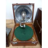 A LEATHER CASED DECCA WIND UP GRAMOPHONE, THE PLAYING ARM FITTING WITHIN THE SOUND BOX INSIDE THE