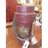 A BROWN CANVAS SHOT CARRIER PRINTED WITH THE ROYAL COAT OF ARMS. H 33.5cms.