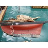 A SMALL ANTIQUE SCRATCH BUILT POND YACHT, MODEL OF THE SAIL BOAT "ALBATROSS", WITH BLACK AND RED
