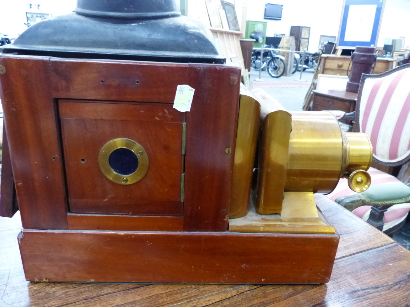 A MAHOGANY MAGIC LANTERN WITH LACQUERED BRASS LENS MOUNTS. W 41cms. - Image 6 of 6