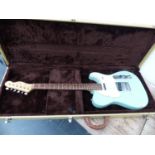 A COPY OF A FENDER TELECASTER ELECTRIC GUITAR IN HARD CARRYING CASE.