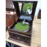 A JAPANESE SANKUDO DISC GRAMOPHONE, THE MAHOGANY LID MIRRORED INSIDE OVER A TURNTABLE WITH A DUST