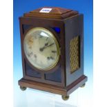 A MAHOGANY CASED JAPY FRERES CLOCK STRIKING ON A COILED ROD, THE CIRCULAR SILVERED DIAL WITHIN
