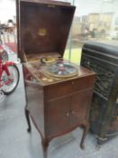 A MAHOGANY CASED HIS MASTERS VOICE WIND UP GRAMOPHONE MODEL 511 WITH BEAD AND RIBBON EDGED LID ABOVE