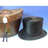 A FRENCH LEATHER CASED BRUSHED SILK TOP HAT.