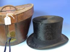 A FRENCH LEATHER CASED BRUSHED SILK TOP HAT.