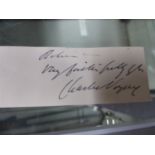 AN INK SIGNATURE OF CHARLES VOYSEY.