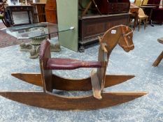 A SCRATCH BUILT TOY ROCKING HORSE WITH LEATHER SEAT.