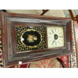 AN AMERICAN GLAZED MAHOGANY CASED WALL CLOCK BY BREWSTER AND INGRAHAMS, THE MOVEMENT STRIKING ON A