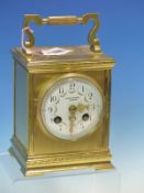 A FRENCH GLAZED BRASS MANTEL CLOCK RETAILED BY JAMES WALKER, THE FLORAL SWAGGED DIAL WITH ARABIC