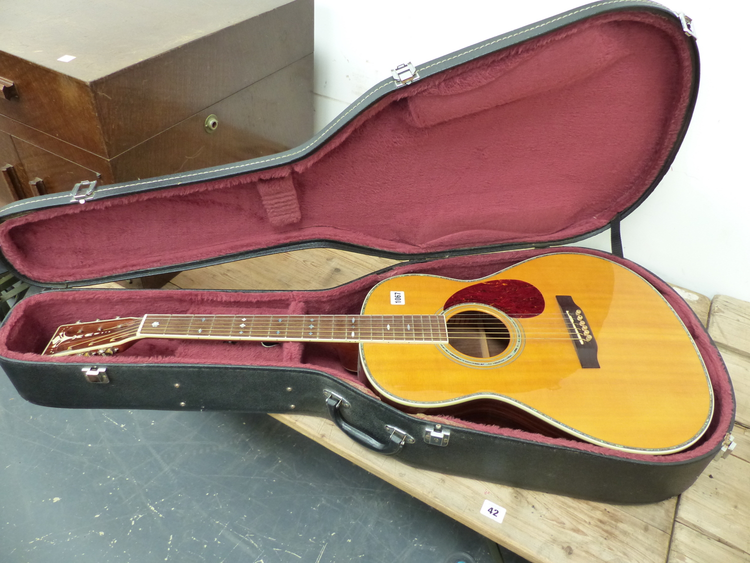 A COPY OF A GIBSON ACCOUSTIC GUITAR, No 38090 WITH A CARRYING CASE. NOTE THIS GUITAR IS A RE-BADGED