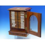 A VICTORIAN GLAZED MAHOGANY CABINET OF SIXTEEN DRAWERS OF MICROSCOPE SLIDES LARGELY PRIVATELY