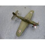 AN AMERICAN WORLD WAR II MODEL WAR PLANE, THE THREE BLADED PROP POWERED BY A LIVE FUEL ENGINE, THE