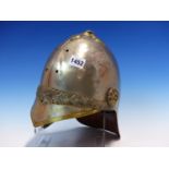 A BRASS TRIMMED ALUMINIUM HELMET, POSSIBLY FOR THE 7th. DRAGOON GUARDS, A LAUREL BAND ABOVE THE PEAK
