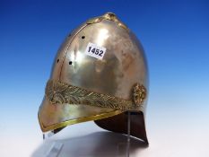 A BRASS TRIMMED ALUMINIUM HELMET, POSSIBLY FOR THE 7th. DRAGOON GUARDS, A LAUREL BAND ABOVE THE PEAK