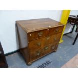 AN INLAID WALNUT GEORGIAN AND LATER FOUR DRAWER CHEST, BUN FEET. H. 84 x W. 94 x D. 58cms.