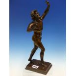 AFTER THE ANTIQUE, A BRONZE FIGURE OF THE DANCING FAUN, HANDS RAISED AND HE STEPS ACROSS THE
