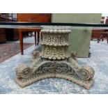 AN ANTIQUE CARVED HARDWOOD PEDESTAL WITH LATER PLATE GLASS TOP.