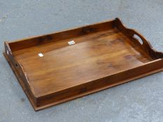 A YEW WOOD RECTANGULAR TRAY WITH HANDLED PIERCED TO EACH NARROW END OF THE GALLERY. 66 x 44cms.