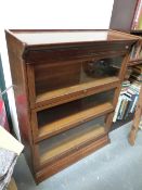 A GLOBE WERNICKE TYPE THREE TIER BOOKCASE. 87 x 36 x H. 102cms.