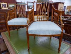 A PAIR OF NEOCLASSICAL STYLE PAINTED SATIN WOOD ARMCHAIRS, THE TOP RAILS PAINTED WITH VILLAGE SCENES